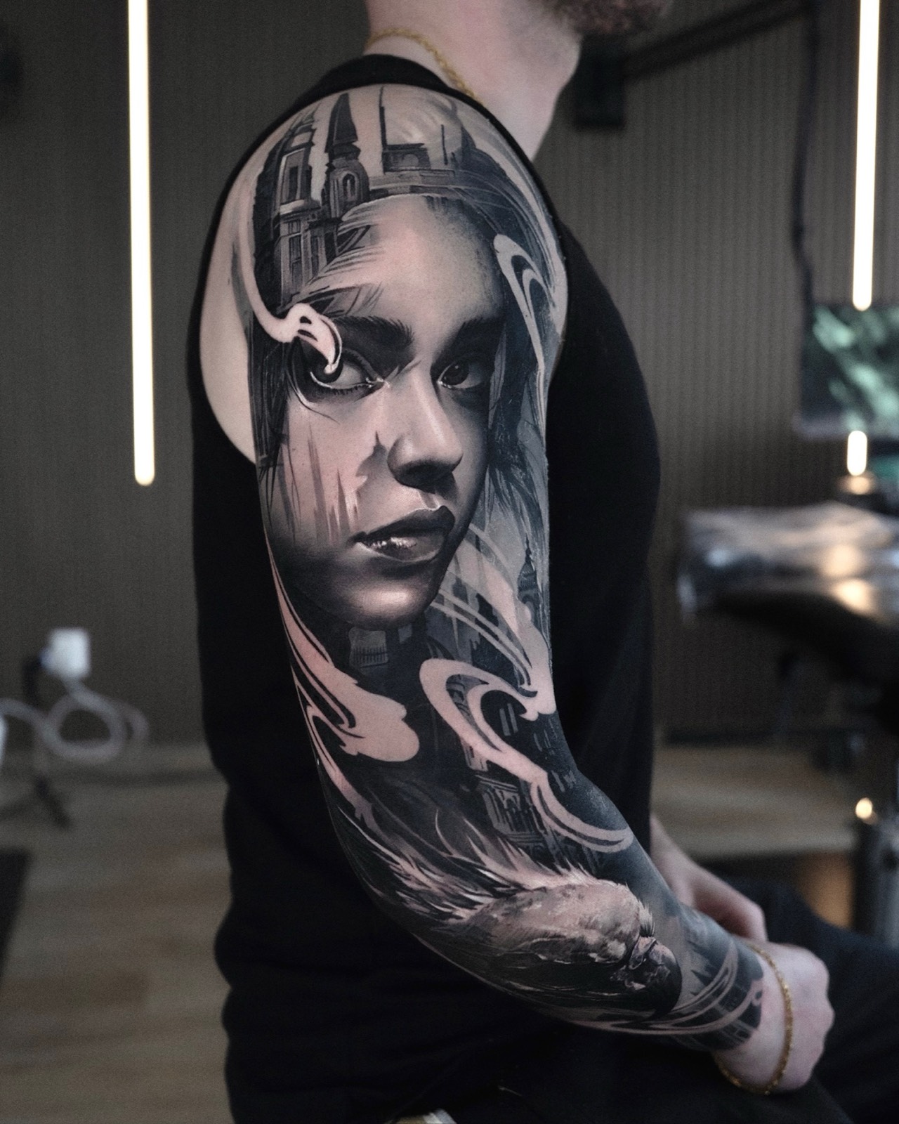 Black and grey portrait sleeve with architectural details and a raven