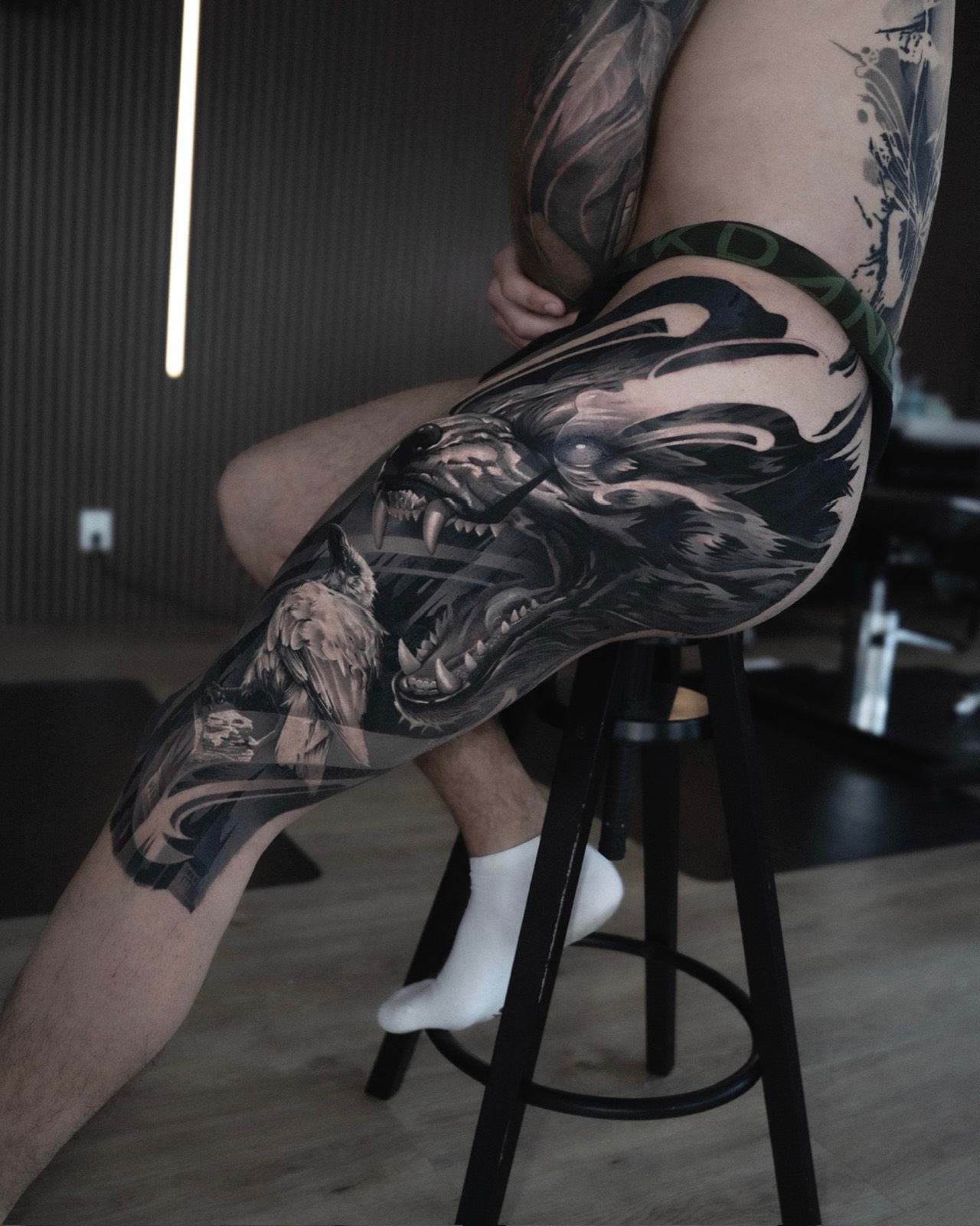 Black and grey leg sleeve with a wolf, owl and abstract movement
