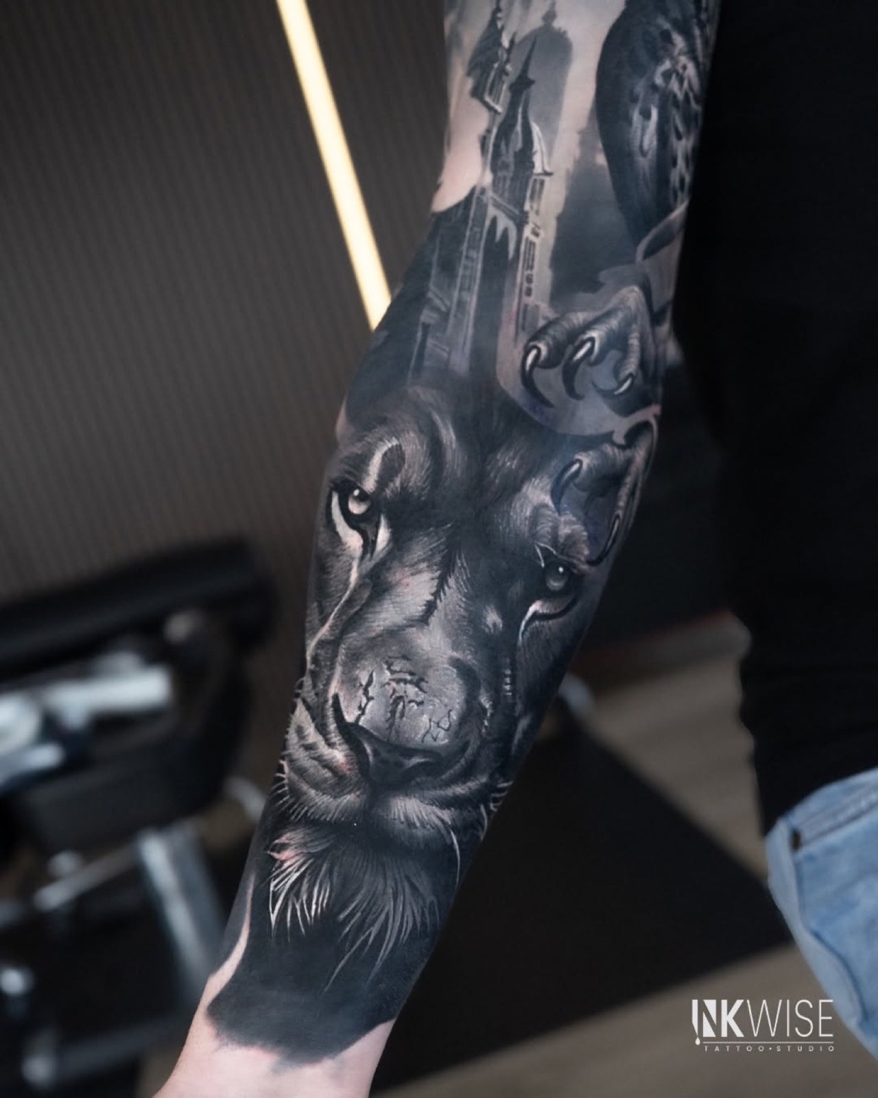 Black and grey wolf sleeve with an owl and gothic architecture